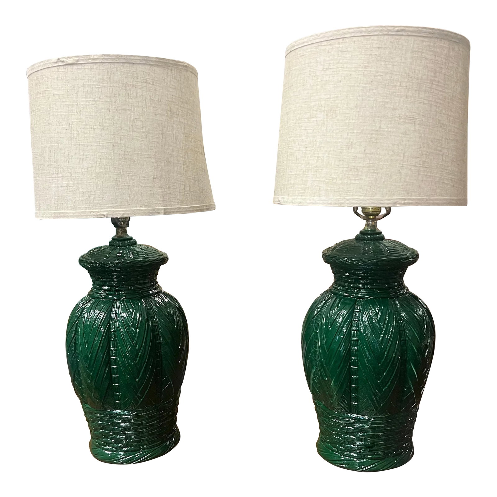 Vintage Green Basket Weave Ceramic Table Lamps - A Pair.: A pair of palm beach chic emerald green lacquered ceramic table lamps with an interesting grouping of different basket weaves as the pattern. Paired with new linen shades. C. 1960's Measurements are o