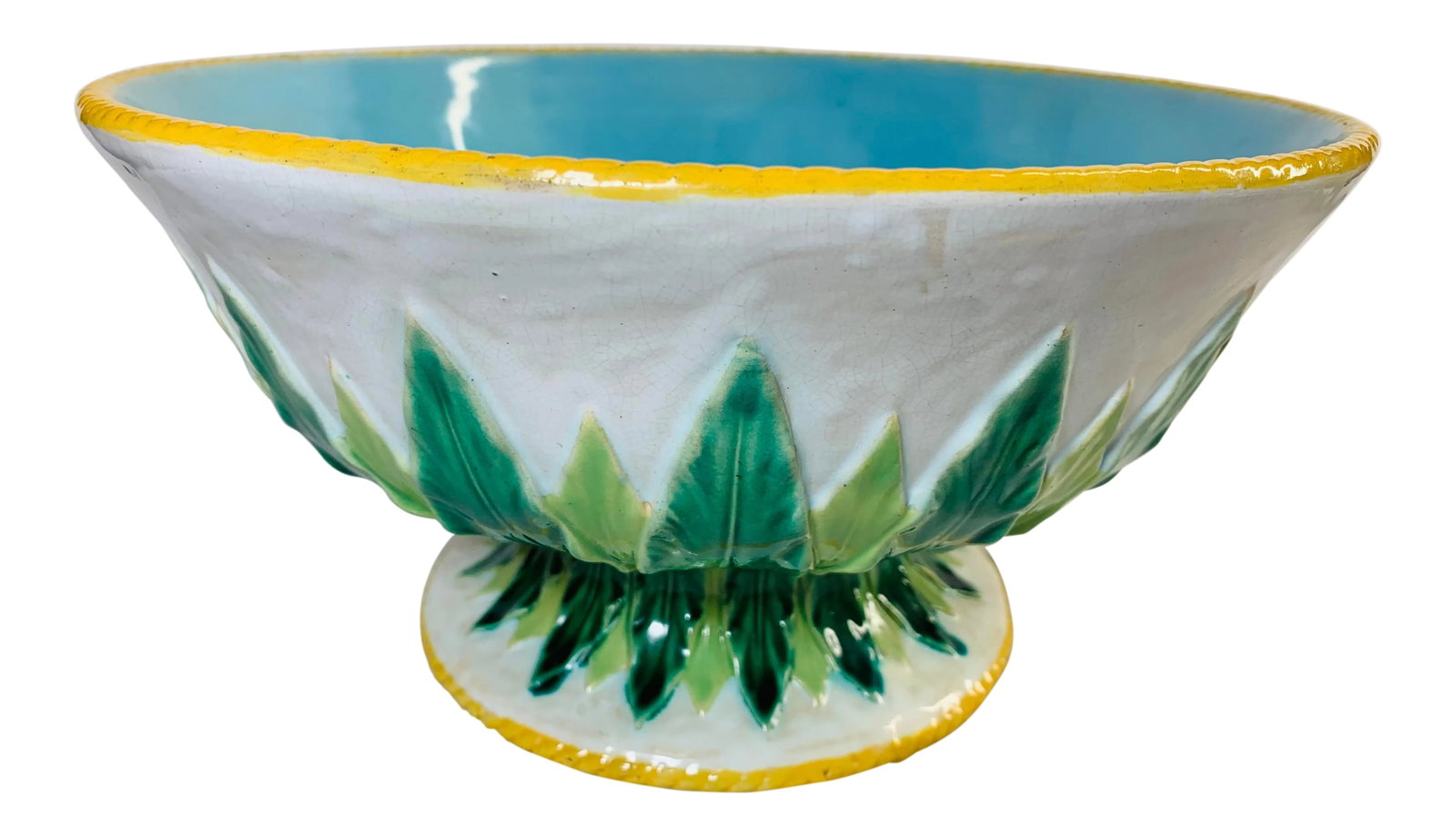 Early 19th Century Large White and Turquoise Blue Majolica Bowl With "Acanthus" Leaf Accents by Geor: Offered is a large English Majolica pottery bowl on an attached pedestal. This beautiful and collectible piece features a bright white outer glaze decorated with an ochre twisted rope trim with