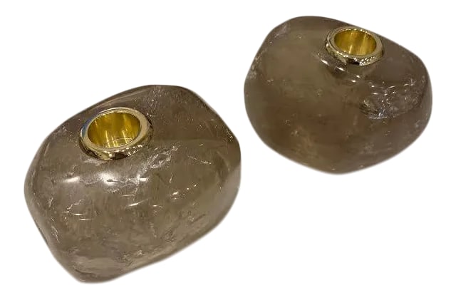 Smokey Quartz Taper Holders - a Pair: This is a stunning pair of taper candle holders made out of solid pieces of smoky quartz. They taper holder itself is in a shiny gold. They have great marbling and add the perfect modern touch to