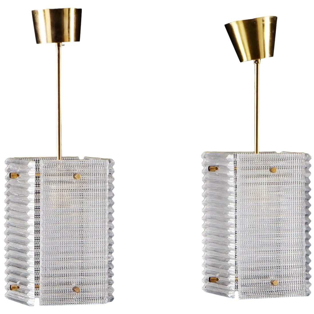 Pendants by Orrefors - a Pair: A pair of pendants by Orrefors, Sweden, circa 1960. Dimension: Height 50 cm (20"). Existing European wiring, we do not guaranty functionality. Rewiring available. Condition: Alterations: Original