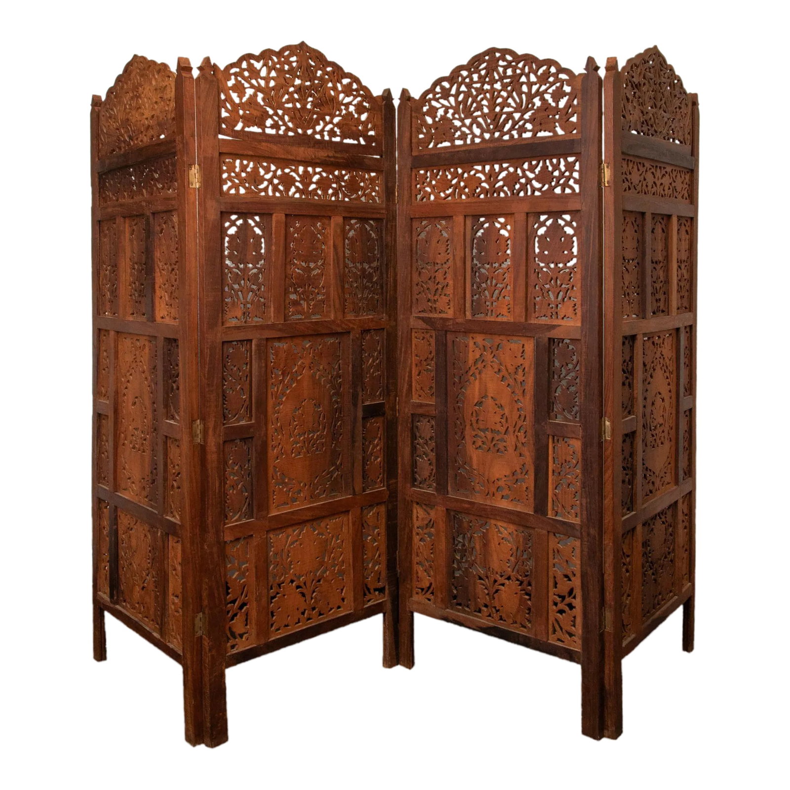 Late 20th Century Four Panel Carved Wood Room Divider: A handcrafted Balinese four-panel room divider screen, artisan unknown. Solid teak with intricate detail and workmanship framed together to form four separate panels, then joined with brass hinges to 