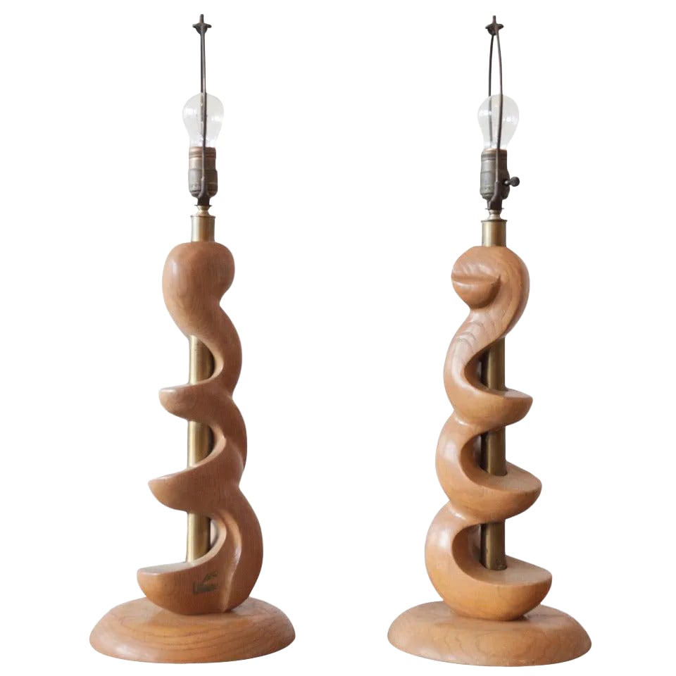 Sculpted Wooden Lamps by Light House - a Pair: A pair of sculpted wood lamps by Light House Lamp and Shade Co., Los Angeles CA. Wood and lacquered brass. Both lamps have tags, one is worn off a bit. Condition: Alterations: Unknown Imperfections: S