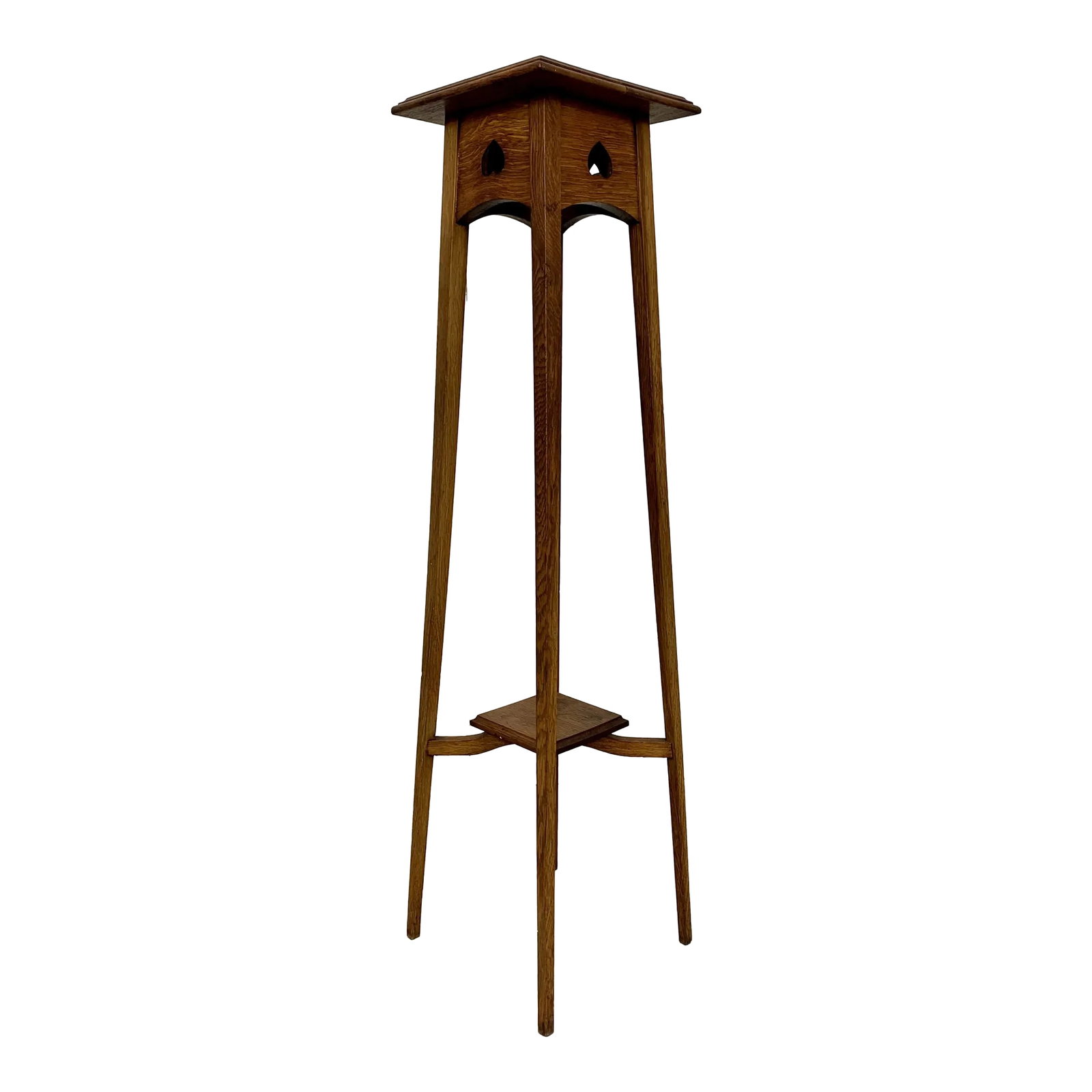 Arts and Crafts Plant Stand: Very tall candle / plant stand made of solid quarter sawn oak with spade shaped design on the apron of the top. Condition: Alterations: Original Condition Unaltered Imperfections: Some Imperfections C