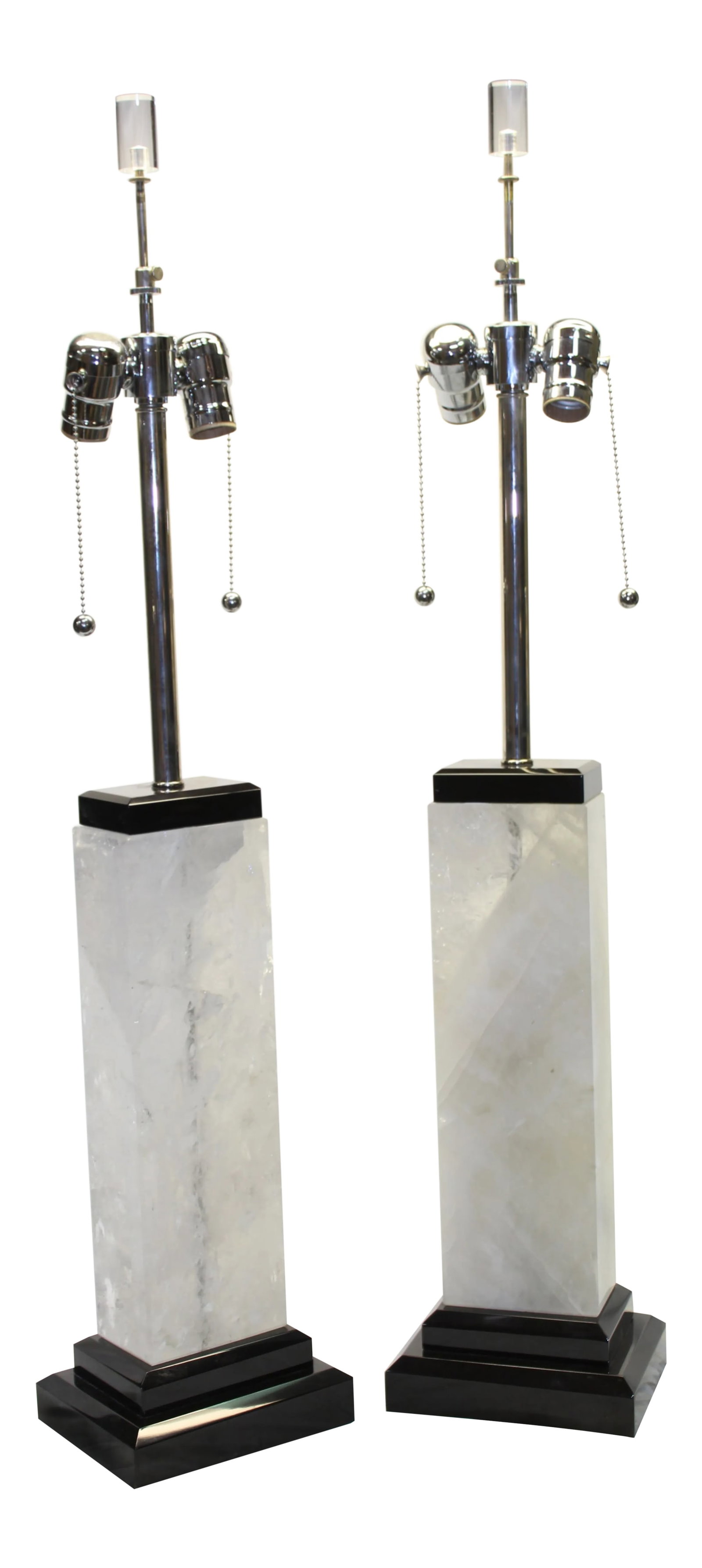 Modern, Rock Crystal Lamps on Black Marble Base - A Pair: Great looking (Solid blocks) of Brazilian rock crystal drilled to make lamps. Mounted on double absolute black marble bases. The top has a cover block. Metal parts are hi-polished Nickel finish with