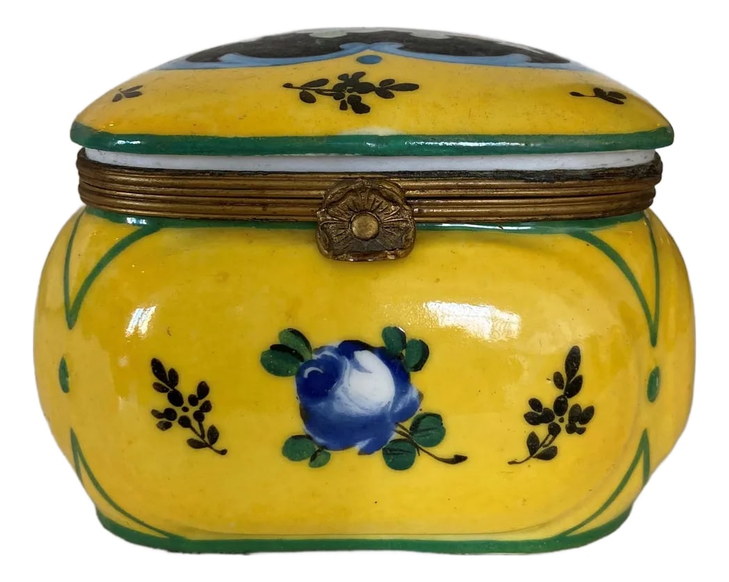 Antique French Handpainted Sevres-Style Porcelain Keepsake Box With Ormolu Clasp: A beautifully detailed antique French hand-painted porcelain keepsake box, marked Sevres on the underside and decorated in a vivid yellow ground with scattered florals in black, blue, and green. The