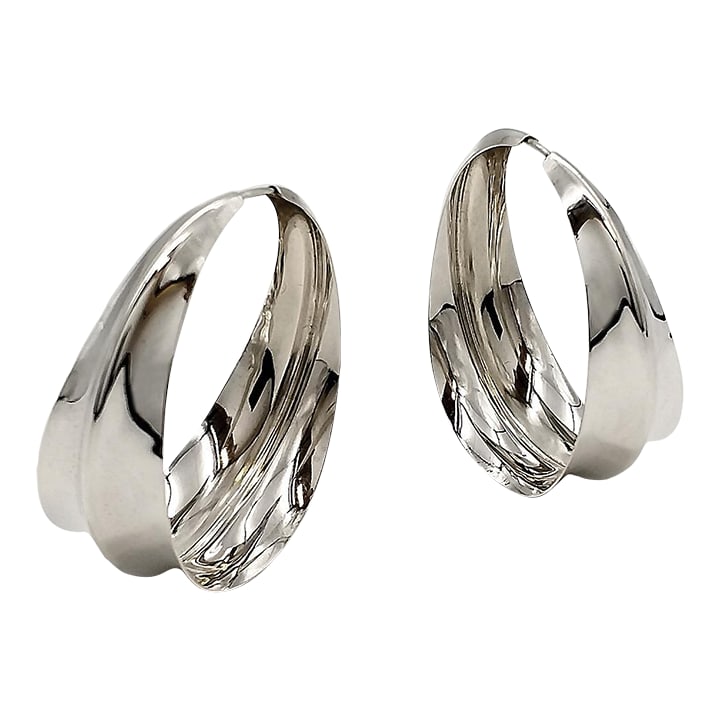 1990s Ridge Hoops, Anticlastic Silver Earrings, Gerhard Herbst Studio,Mid Century Style., Set of 2: These 1 7/8'' hoops were created in response to the large earring fashion trends in the late 1980s. First produced in 1989 this design remained in our productions until around 1995. This particular