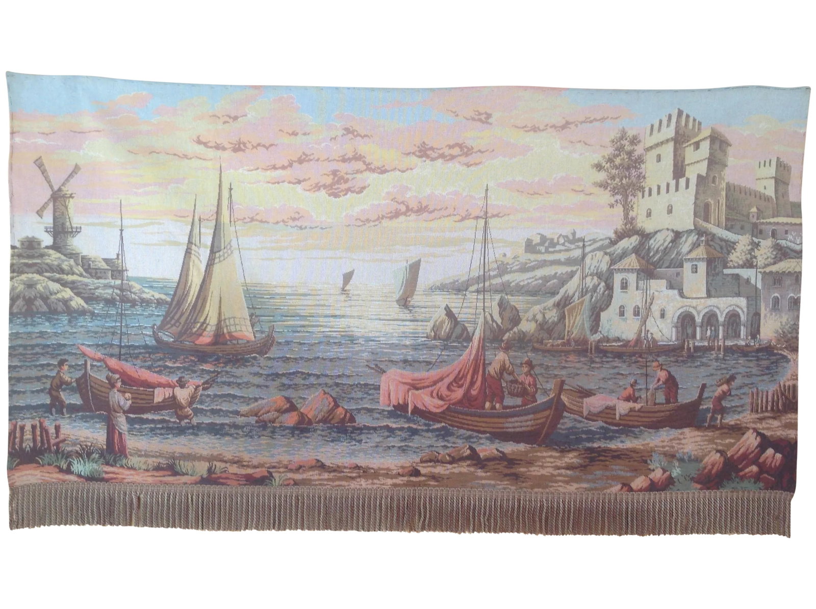 French Dutch Port Scene Tapestry: Woven on a loom, this vintage wall tapestry depicts a Dutch port scene complete with fishing boats, a castle, and a wind-mill in the background. The colors suggest it is sunset with a pink overcast