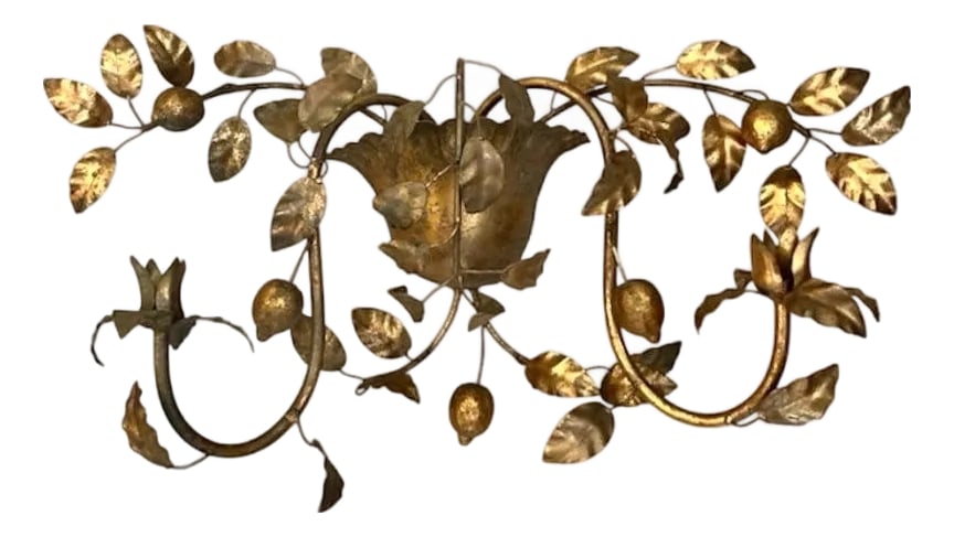 Vintage Italian Gilt / Gold Tole Double Arm Citrus Lemon Basket Candle Sconce: A stunning, vintage gilt tole candle sconce. Features an iron, double arm sconce embellished with a central fluted basket and branching arms adorned with leaves and lemons. Currently unwired, but can