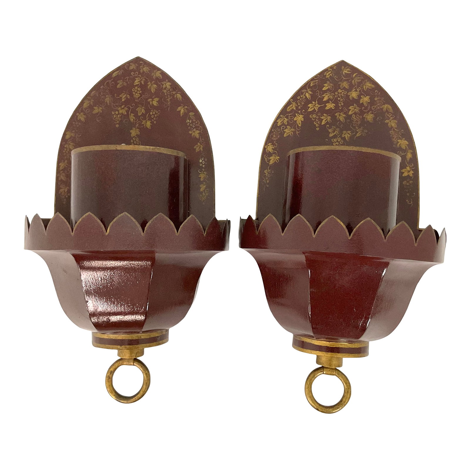 Vintage French Tole Wall Sconce Pair: This elegant pair of wall sconces is crafted in richly lacquered burgundy tole, accented with fine hand-painted gilt floral motifs. Each sconce features a scalloped crown edge framing a cylindrcal can