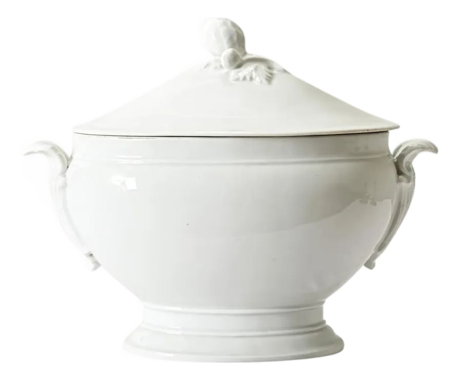 French 19th Century Ironstone Oval Tureen: A gorgeous 19th century white ironstone tureen from France, complete with the original fitted lid, this is a classic serving piece for any kitchen. The charming design incorporates an artichoke