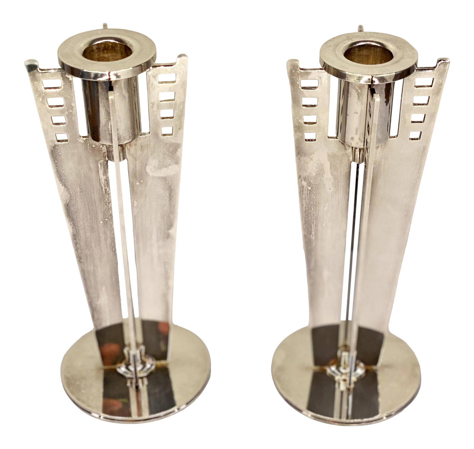 Mid-Century Maestri by Gorham Silverplate Candleholders- a Pair: This is a really cool pair of mid-century modern candle holders. Each of the candle holders is silver plated adding to the classic and sophisticated look of them. They design details are reminiscent o