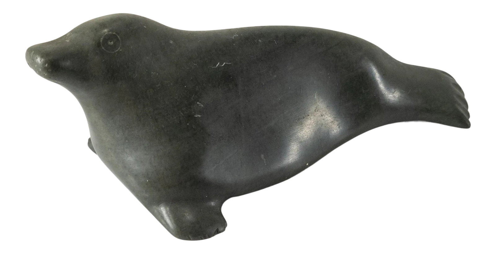 Native American Indian Inuit Serpentine Seal Carving: We are selling this small carved green serpentine type stone seal figure, signed on the base for the Native American Indian Inuit carver. Condition: Good Dimensions: Height 2 Inches 5.1 cm Width 5 1/2