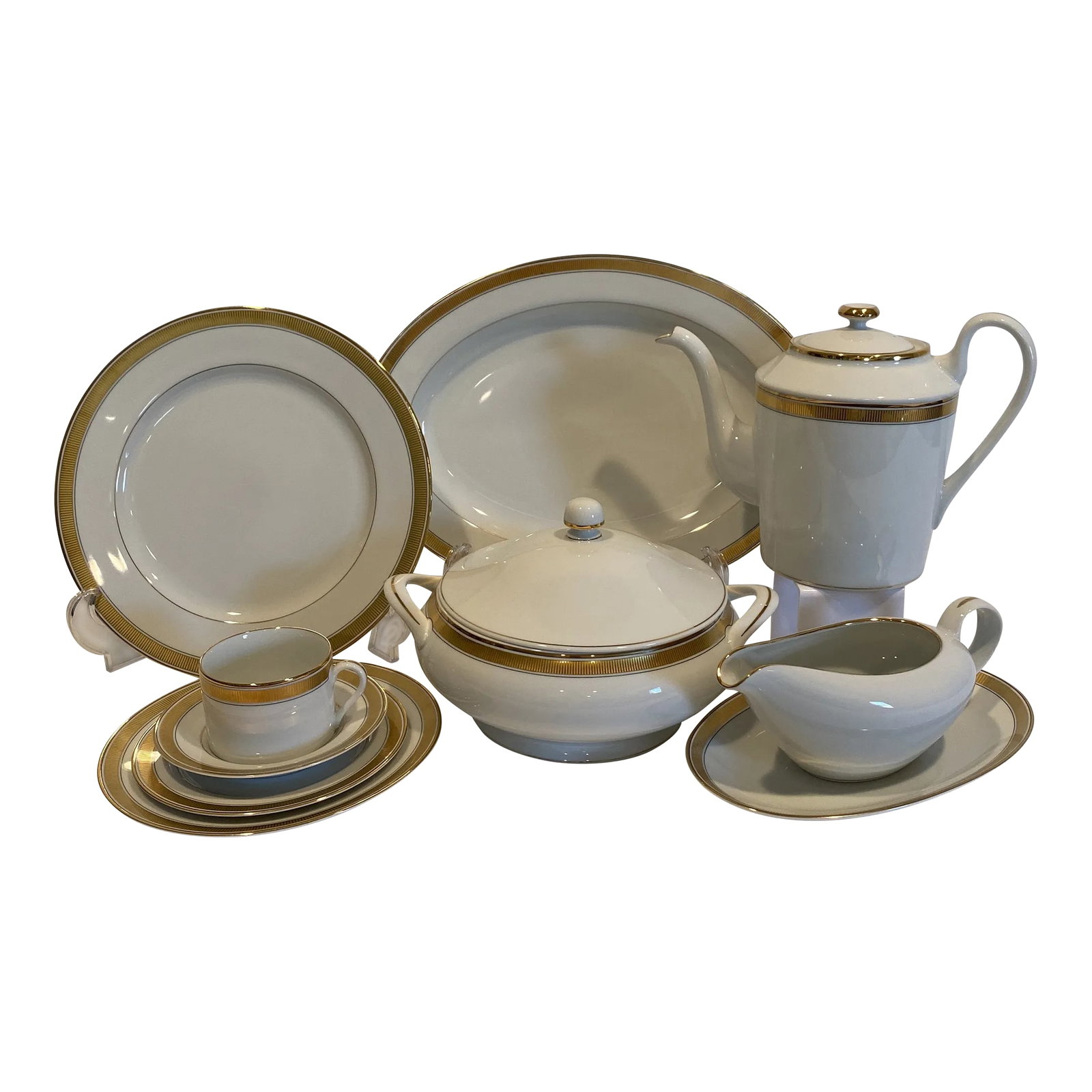 1990's Fitz and Floyd "Oak Park" Dinnerware Set- 37 Pieces: "Oak Park" by Fitz and Floyd (circa 1990's). Service for 6 plus hostess pieces. Oak Park's off-white porcelain and sleek ribbed band of gold is elegant and on trend with the resurgence of interest in