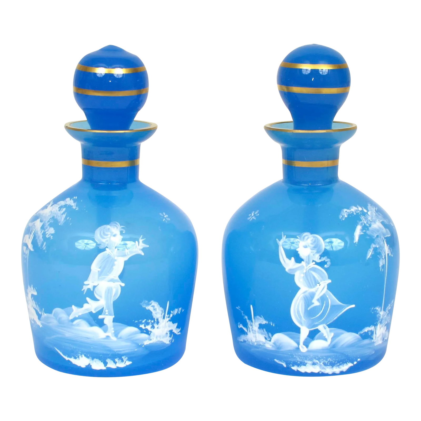 Antique 1890s Mary Gregory Blue Glass Cruet Bottles Boy & Girl in Landscape - Set of 2: This Antique Pair of 2 Mary Gregory Blue Glass Cruet Bottles Boy + Girl in Landscape is in Excellent condition with no chips, cracks or repairs. They are an absolutely stunning pair. One cruet depicts