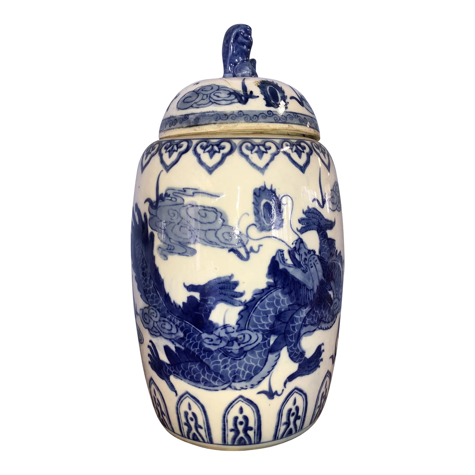 Vintage Chinese Ginger Jar: A beautifully aged blue and white porcelain ginger jar and lid with a Phoenix motif. There is an old 4 character Chinese mark to the underside. This jar would add great Asian decor to the kitchen or