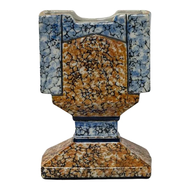 1920s French Ceramic Vase: Made in 1920s France, this ceramic vase takes inspiration from the bold shapes and luxurious materials of the Art Deco movement. The blocky, graphic silhouette eschews soft curves in favor of clean