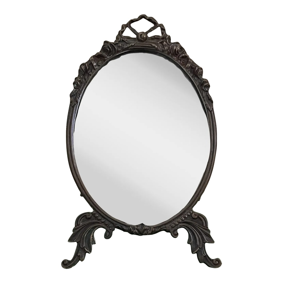 Antique Victorian Table Mirror Oval Shape With Ornate Brass Carving: Gorgeous and rare Antique Victorian Oval Mirror with stand. The brass frame is solid with exquisite carving. Even the stand is in solid brass with carving. the back of the mirror is lined with a fabri