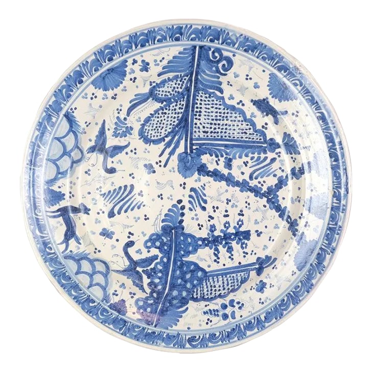 Large Mexican Blue & White Pottery Wall Plate: Large Mexican Blue and white hand painted pottery platter marked GTO for Guanajuato. Fanciful images of birds, fish, flora, and fauna. Three holes on the back for hanging. Condition: Alterations: Orig