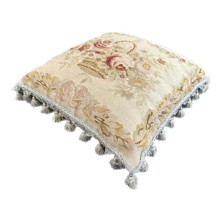 2000s Hand-Woven Wool Aubusson Weave Pillow With a Pink Flower Basket Design: The soft blend of wool offers comfort and quality to this pillow. The delicate pink botanical patterns create a soothing atmosphere that's both inviting and relaxing. Accentuating its beauty, the pill