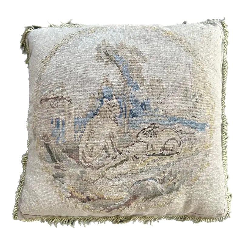 2000s Beige and Blue Aubusson Style Wool Decorative Pillow With Green Tassels: This elegant piece features soothing beige with a touch of blue, complemented by vibrant green tassels. Its unique design showcases a woven illustration of adorable animals, adding a touch of whimsy