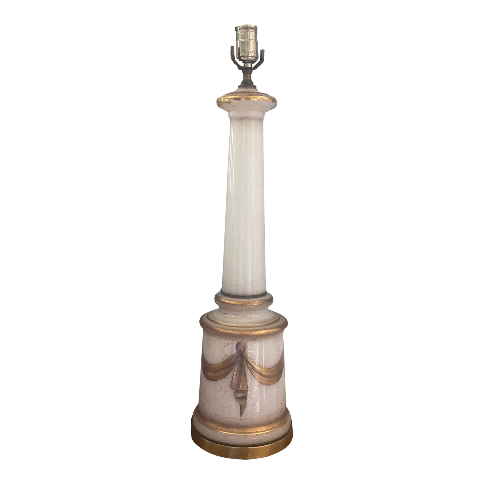 Midcentury White Opaline Glass Gilded Swag Table Lamp: Listing is for a vintage possibly antique white Opaline glass table lamp. The base is accentuated with gilded swags centered across each side. Condition: Alterations: Unknown Imperfections: Some Imper