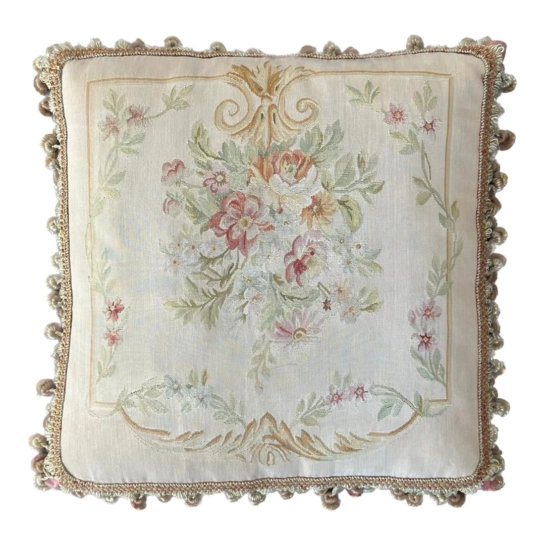 2000s Beige Floral Aubusson Decorative Pillow: This lovely beige pillow is adorned with delicate pink flowers and lush green leaves, creating a delightful botanical motif. The tasteful tassels that surround the border add a touch of elegance to