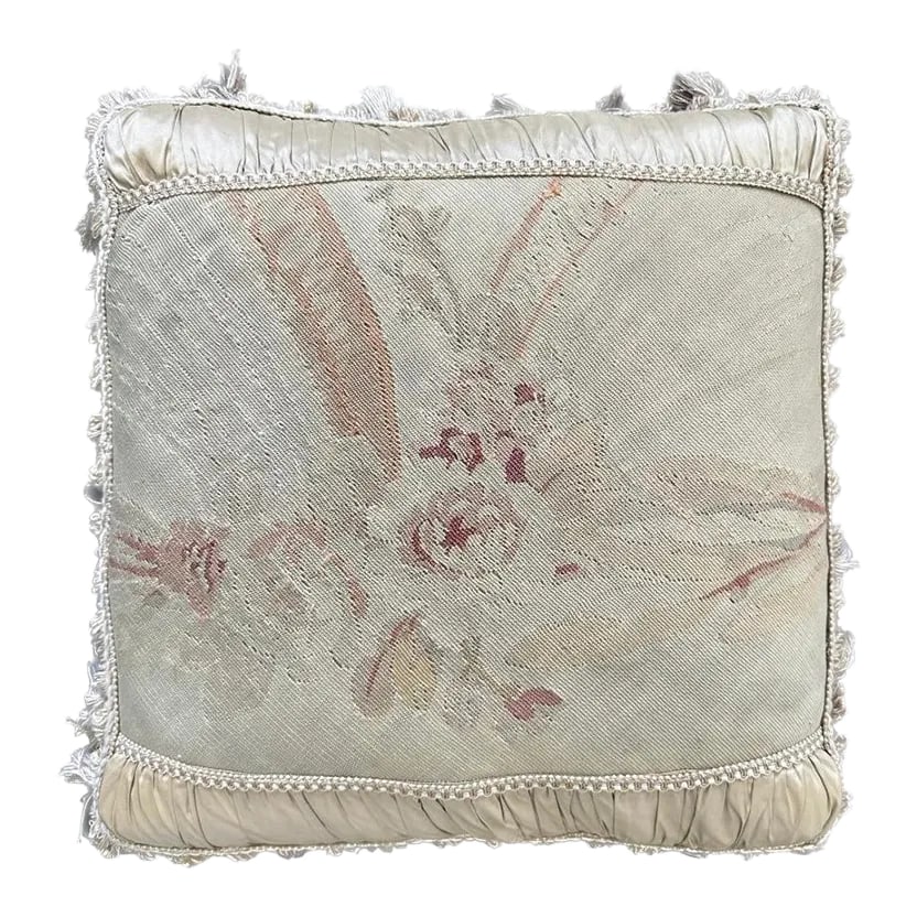 Silk and Wool Beige and Pink Vintage Aubusson Floral Pillow With Tassels: Crafted with a sumptuous blend of silk and wool, this pillow offers both luxurious softness and lasting quality. Delicate pink flowers grace the center, adding a touch of nature's beauty to your space