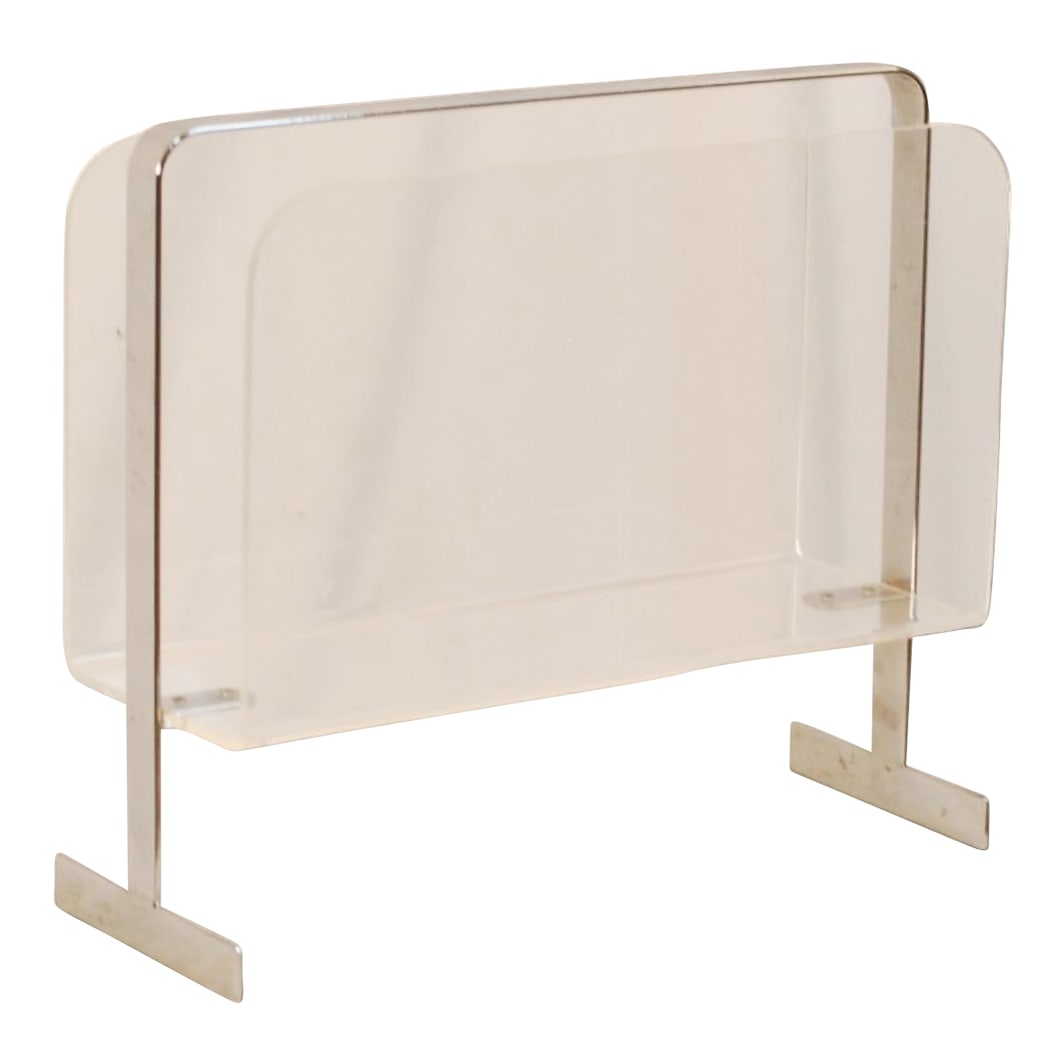 Mid-Century Lucite and Chrome Magazine Rack: Mid-Century Magazine Rack of Lucite and Chrome Discover this cool magazine rack made of shiny chrome and clear Lucite. It's the perfect low-profile accent to a mid-century home or office.