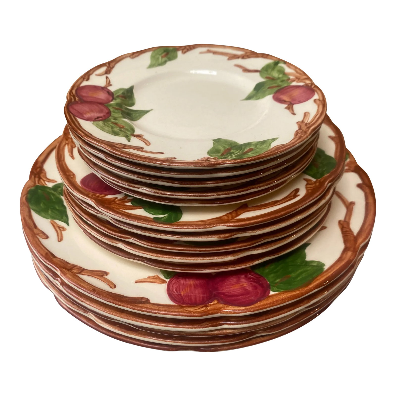 Early 20th Century Franciscanware Apple Pattern Dinner, Salad, and Dessert Plates- 15 Pieces: This set was purchased in the 1930's by my own family and passed down through the generations. Being an early set, these plates have rich detail and depth; I've always particularly like the wooden