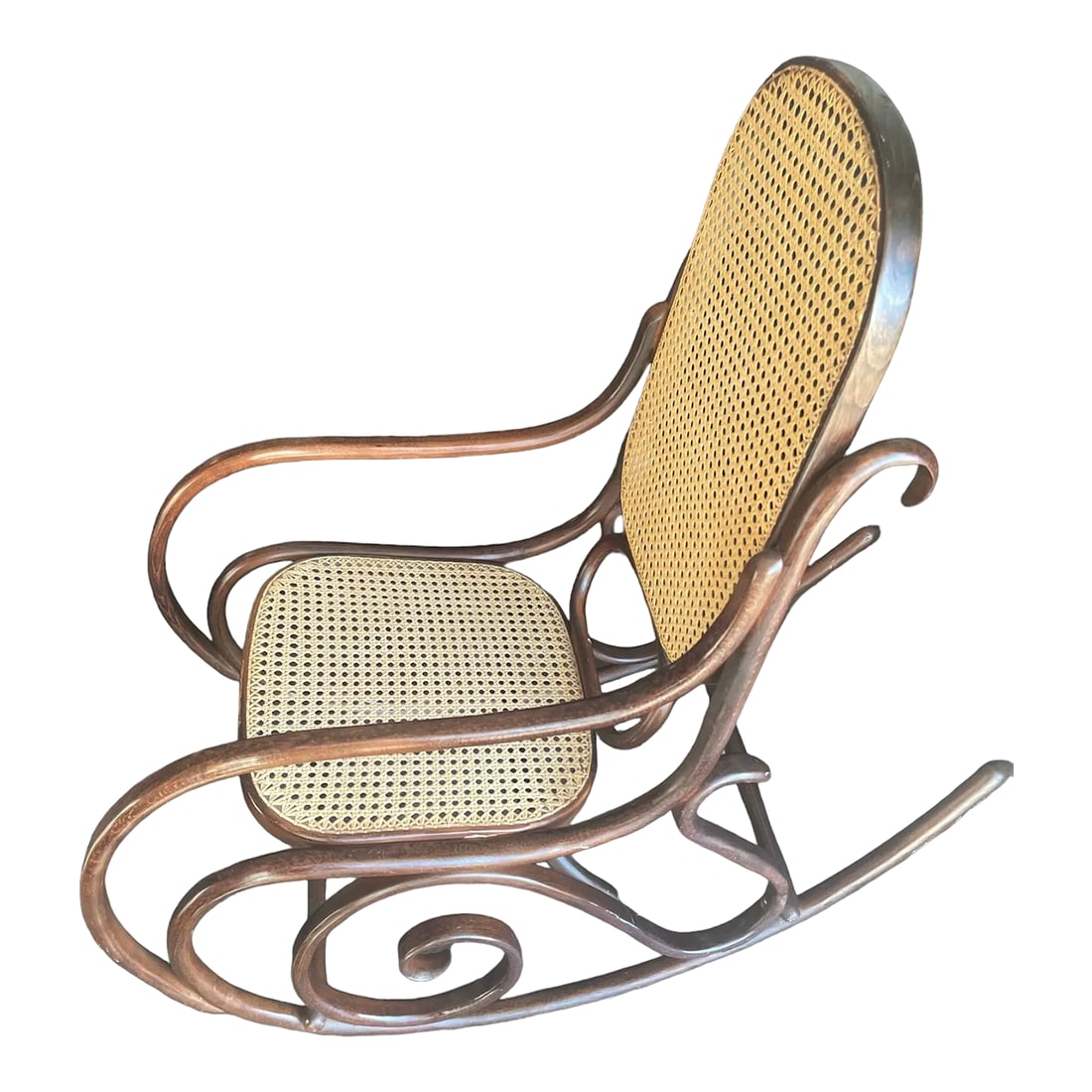 Early 20th Century Bentwood Cane Back Rocking Chair in the Style of Michael Thonet, Made in Poland: Thonet style Bentwood and Cane Rocker, hand caned rocking chair. Hand caning is in excellent condition, tight and without breaks or sagging. This rocker is amazing! Stamped " Made in Poland". I can