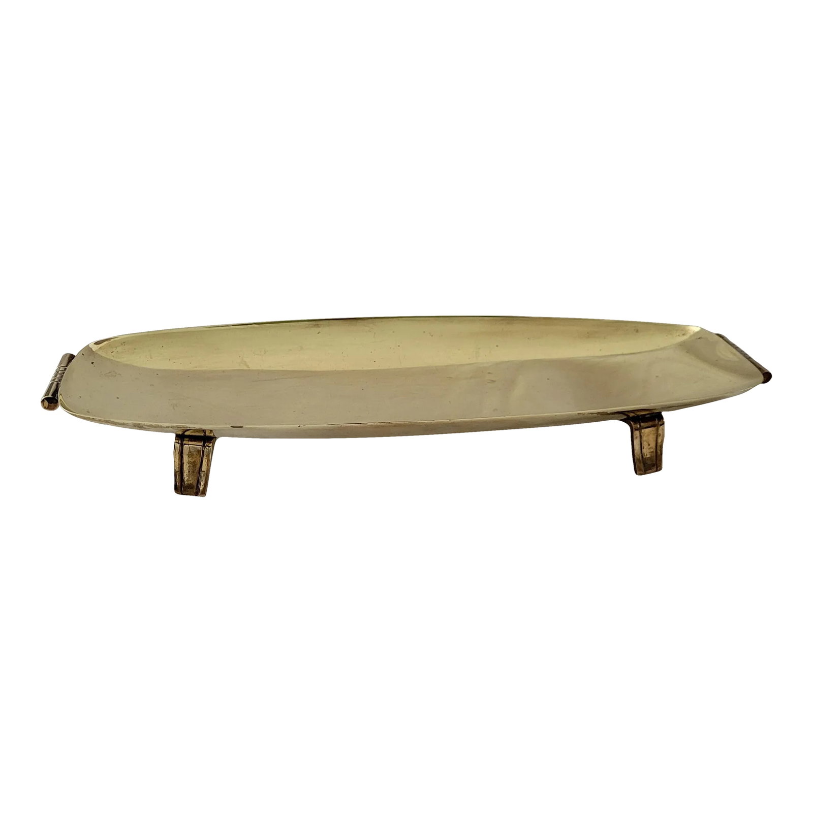1980s Regency Tommi Parzinger for Doryln Silversmiths Brass Footrd Tray: Classy Regency Style Footed brass dish. Designed by Tommi Parzinger for Dorlyn Silversmiths. Almost a Greek revival likeness to it. Maker name stamped on underside of one leg. Measures 14"w x 5.25"d x