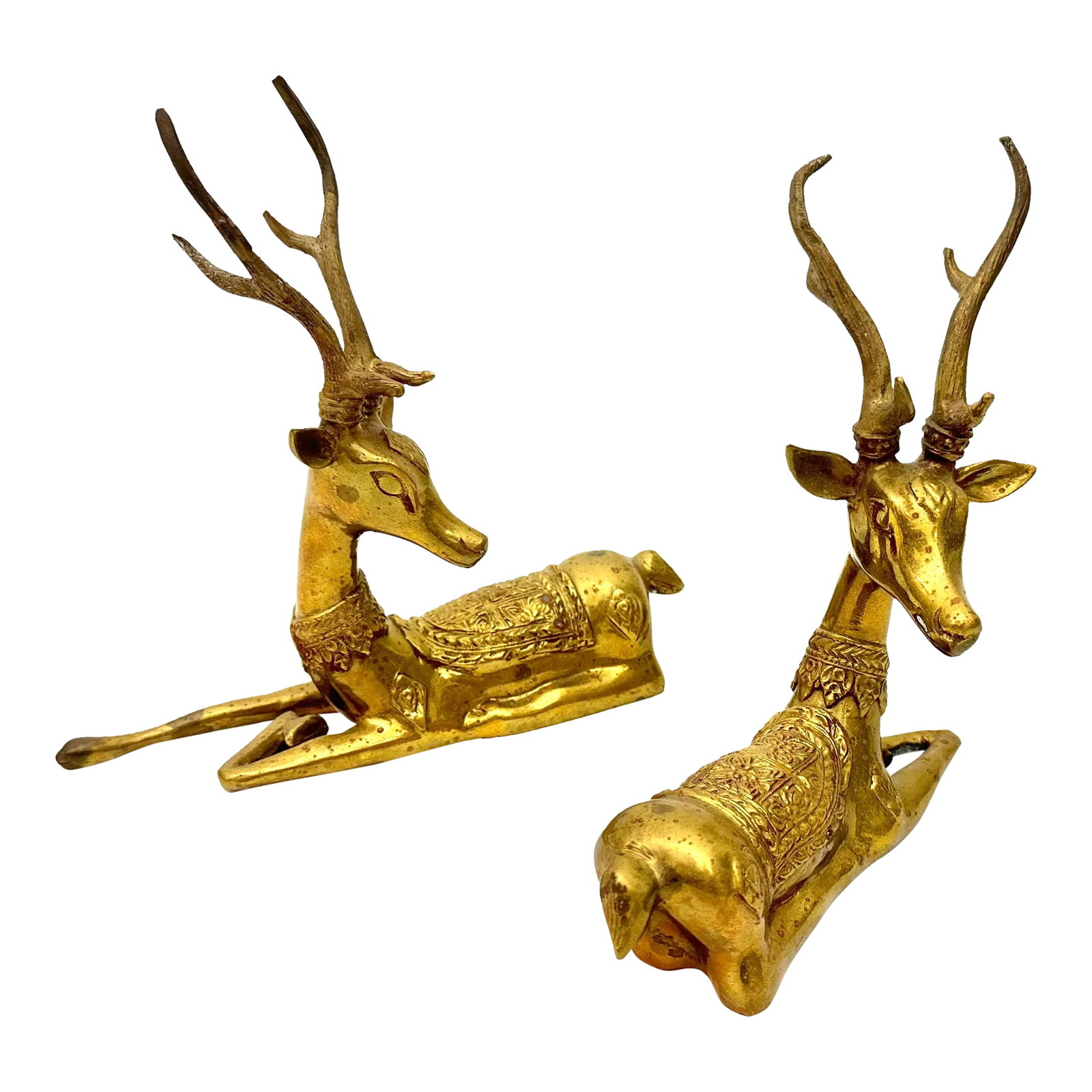 Pair of 1960s Brass Stag Deer: This pair of brass stag deer figurines complement each other and can be positioned in a variety of ways depending on the space; side by side or front and back. Measures: 9" L x 8.5" T x 3" D 8.5" L x