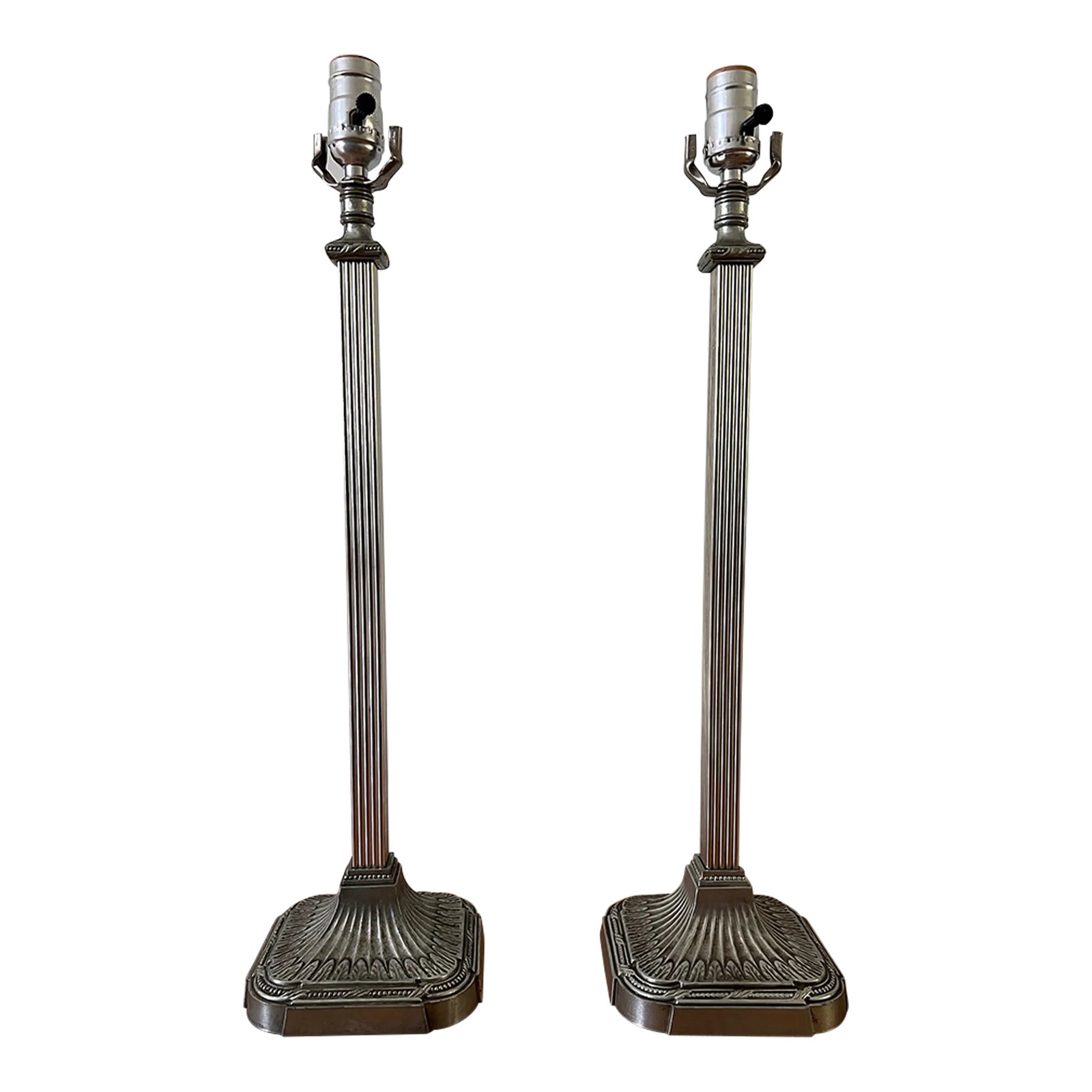Pair of Late 20th Century Silver Square Column Table Lamps: Classic pair of table lamps in a pretty, muted silver finish. Square, fluted columns rise from a tapered base. Would be great buffet lamps or bedside lamps. Each lamp measures 23.75" tall, 6.25" acros