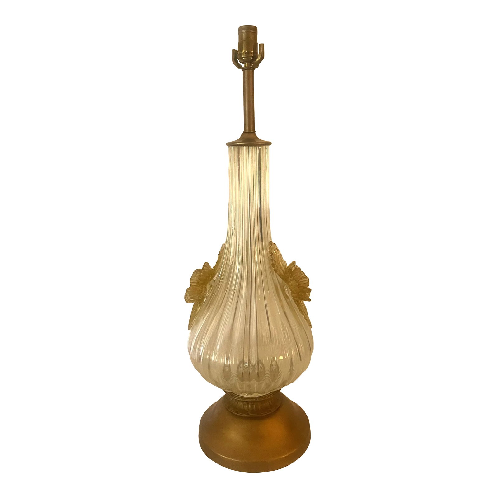 Mid-Century Modern Murano Lamp: Very large Mid-Century, Hollywood Regency style Murano lamp. Mounted on a brass-colored base and accented with grand yellow Murano flowers on each side of the lamp. Condition: Alterations: Original