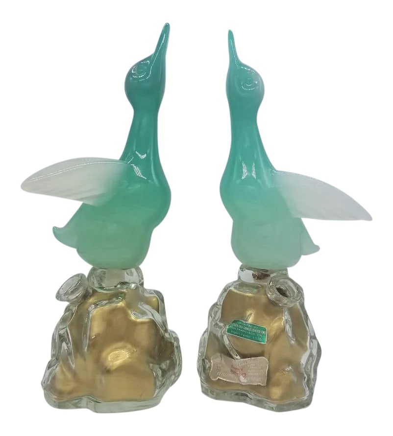 1960s Archimede Seguso Alabastro Murano Glass Bottles-a Pair: Offered for sale is a pair of Archimede Seguso for Girolamo Luxardo Alabastro Glass (it fades from light green to opalescent white) ducks standing over transparent glass bottles presenting a custom