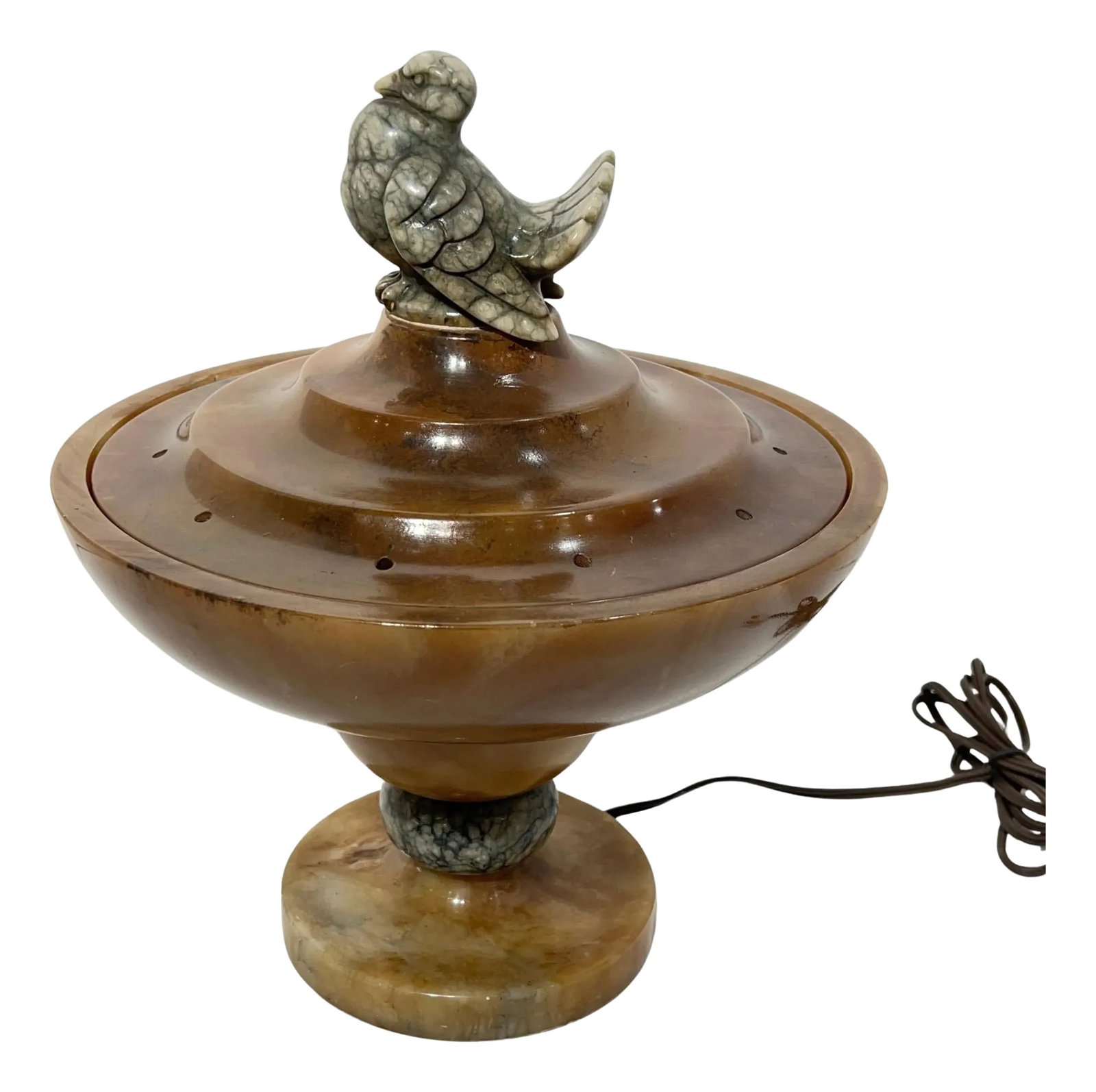 Early 20th Century Art Deco Italian Sculptural Alabaster Lamp with Bird Motif: Art Deco Italian lighted sculpture of a stylized bird, finely carved from alabaster. Of circular shape, with lower bowl housing a single socket and lid with holes that emit light to bathe the top of