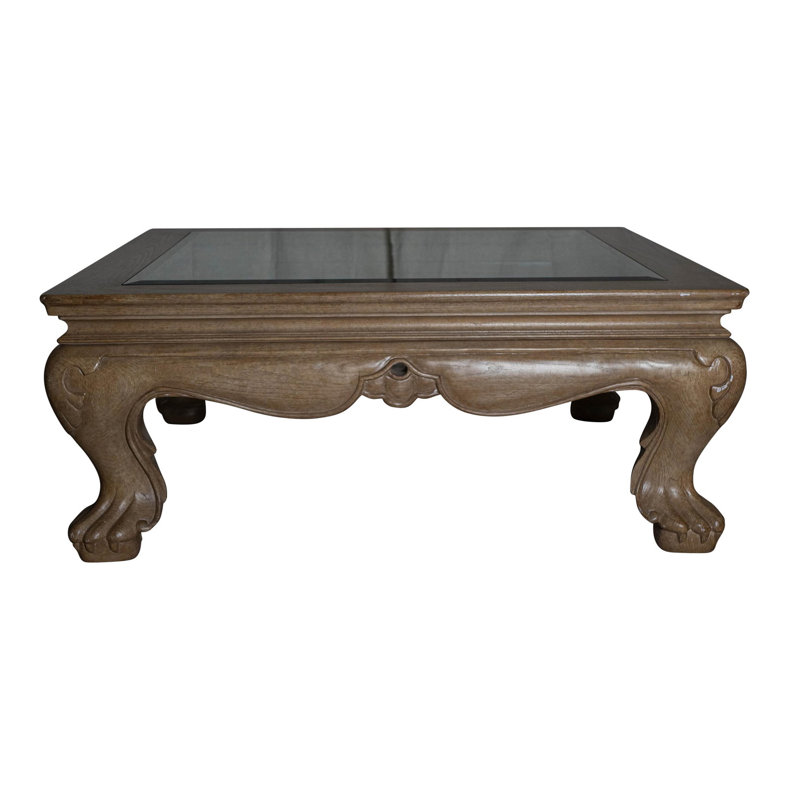 Vintage Marge Carson Carved Wood Glass Top Coffee Table: Elegant and richly detailed, this vintage Marge Carson coffee table features intricately carved wood legs and a beveled glass top that adds lightness to its substantial silhouette. A timeless