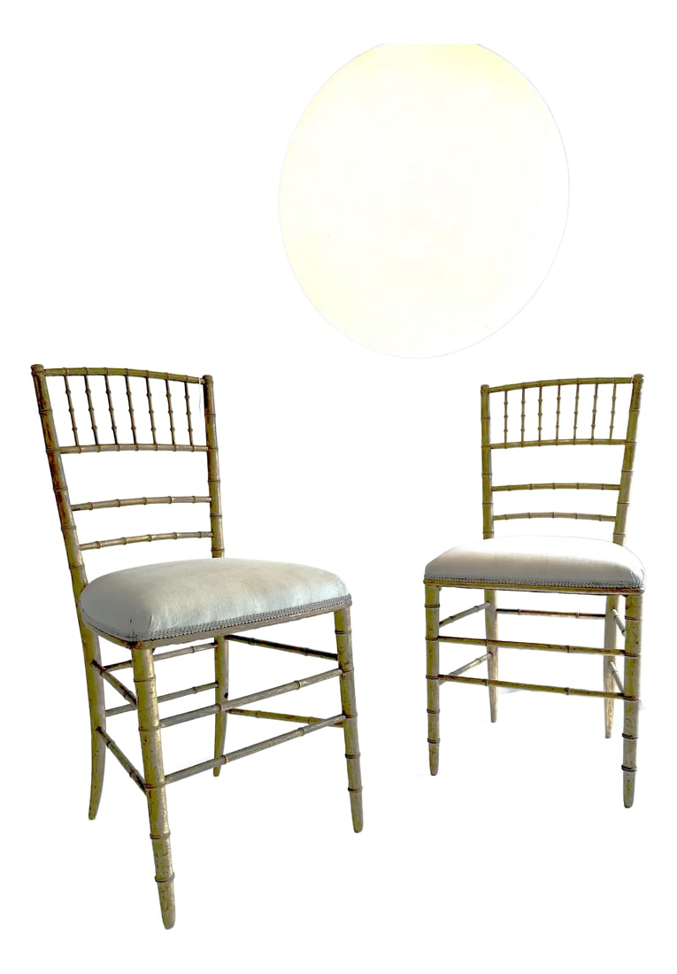 Pair of Mid 19th Century Chiavari Giltwood Chairs: Pair of European giltwood faux bamboo chiavari chairs. These are beautiful accent chairs, lightweight and rather delicate. The natural fabric has stains from age and wear. Condition: Alterations: Unkn