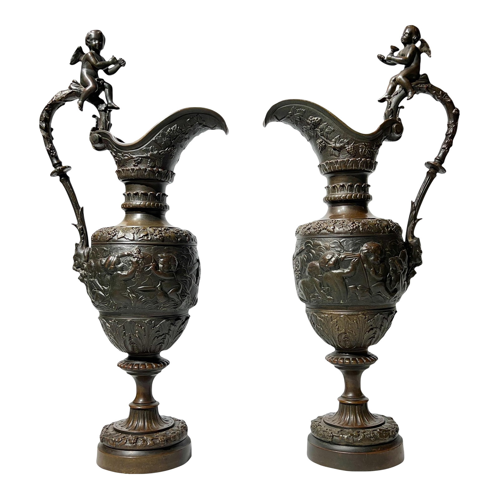Pair Antique 19th Century Neoclassical Bronze Ewers: Pair of antique (19th century) ewers in the Renaissance style, likely of French or Italian origin, measuring an impressive 22 3/4 by 10 by 6 inches and featuring extensive neoclassical motifs includin