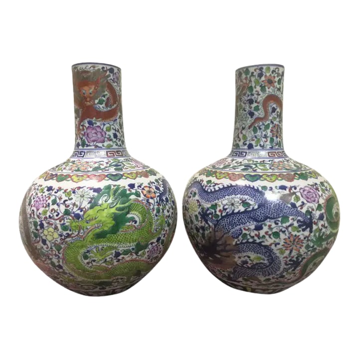 Pair of Chinese Mid 19th Century Porcelain Vases Qing Dynasty Qianlong Marked Blue and White Doucai: These traditional Chinese vintage porcelain vases feature a Qing Dynasty Qianlong mark and are hand-painted with a beautiful blue and white Doucai porcelain Tianqiuping flower pattern. Made with exper