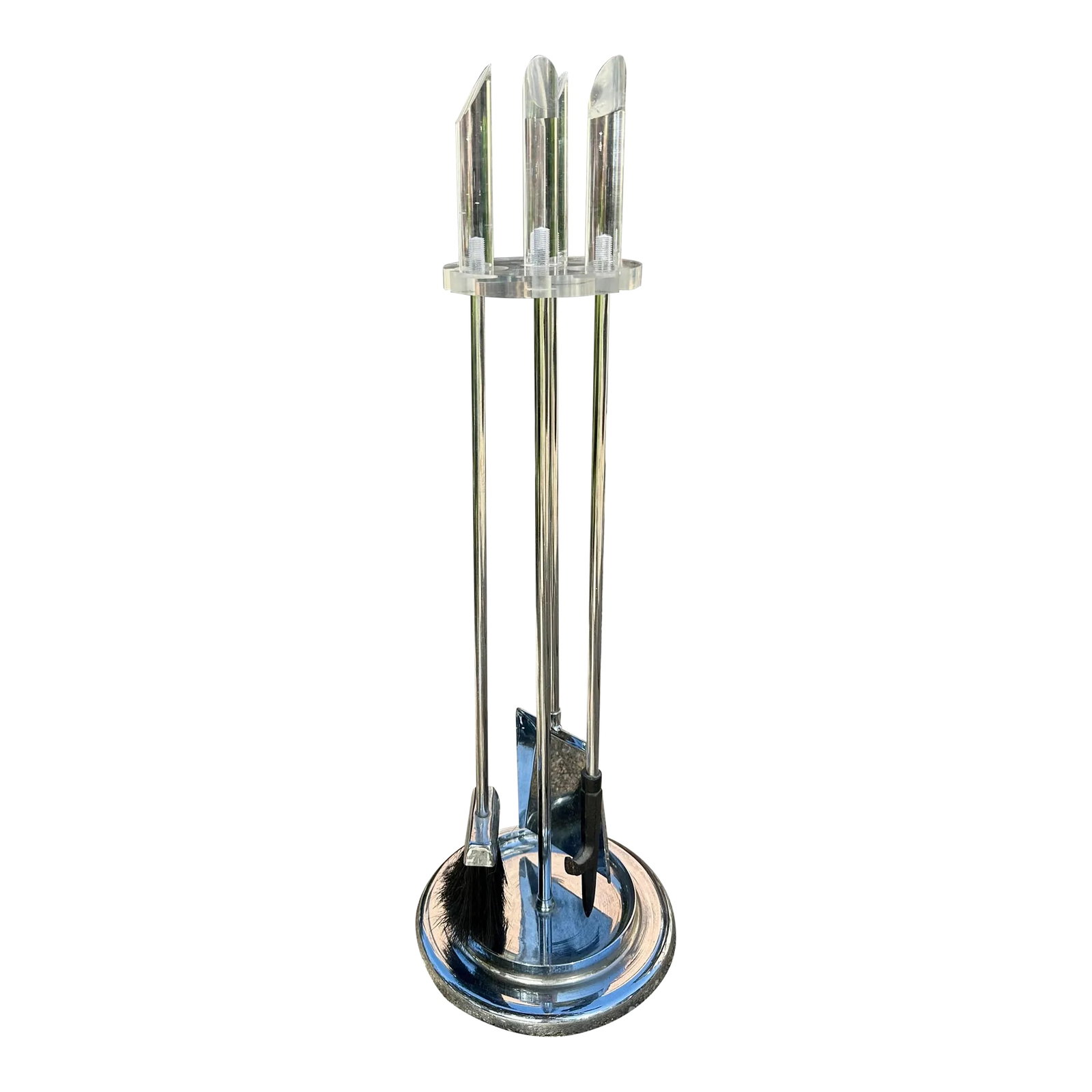 Hollywood Regency Mid-Century Modern Lucite & Chrome Fireplace Tool Set: This refined Mid-Century Modern four piece fireplace tool set was realized in the United States, circa 1970. It includes a shovel, brush, and poker all in lustrous polished chrome with clear Lucite