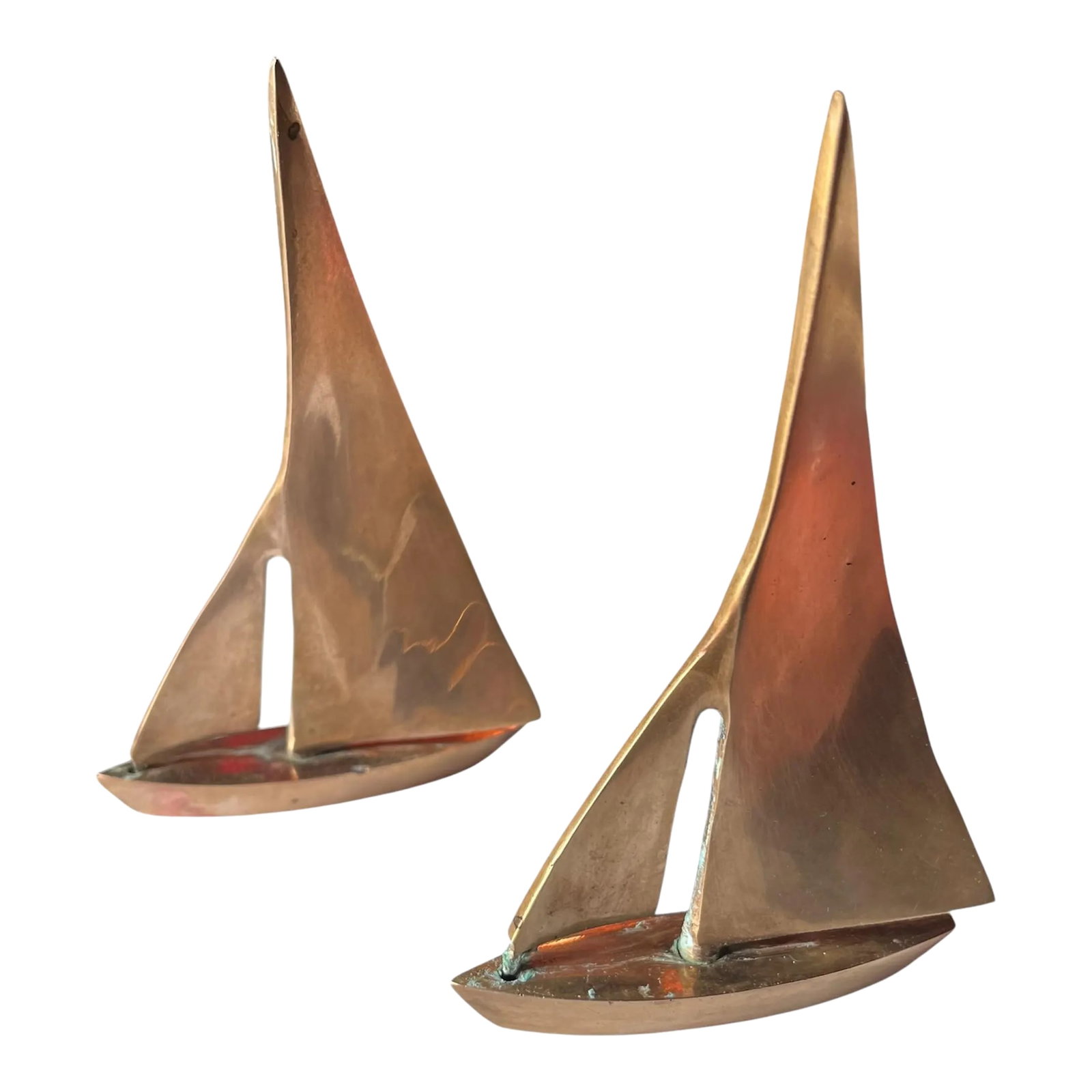 1960s Mid-Century Modern Brass Tabletop Sailboats- Set of 2: Pair of MCM era brass sail boats. Solid brass with boats with full sails! Single Screw on bottom holds sails to boat Buff to preferred sheen. 5.25" x 3.5" x .50" Condition: Alterations: Original