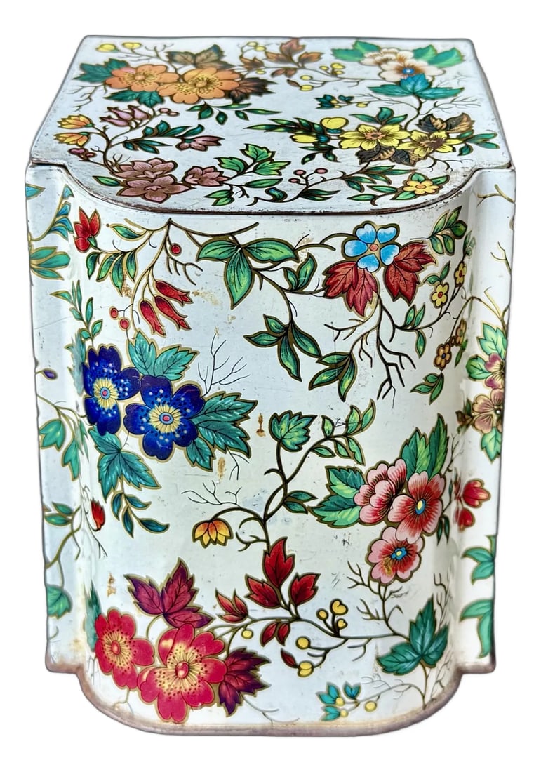 Vintage Daher Floral Tin, Hinged Lid, Blue & Orange Flower Design, Made in England for Daher Long Is: A vintage tin, made in England for Daher Long Island, NY, featuring a classic floral pattern with light and dark blue blooms accented by vibrant orange flowers, all set against a crisp white