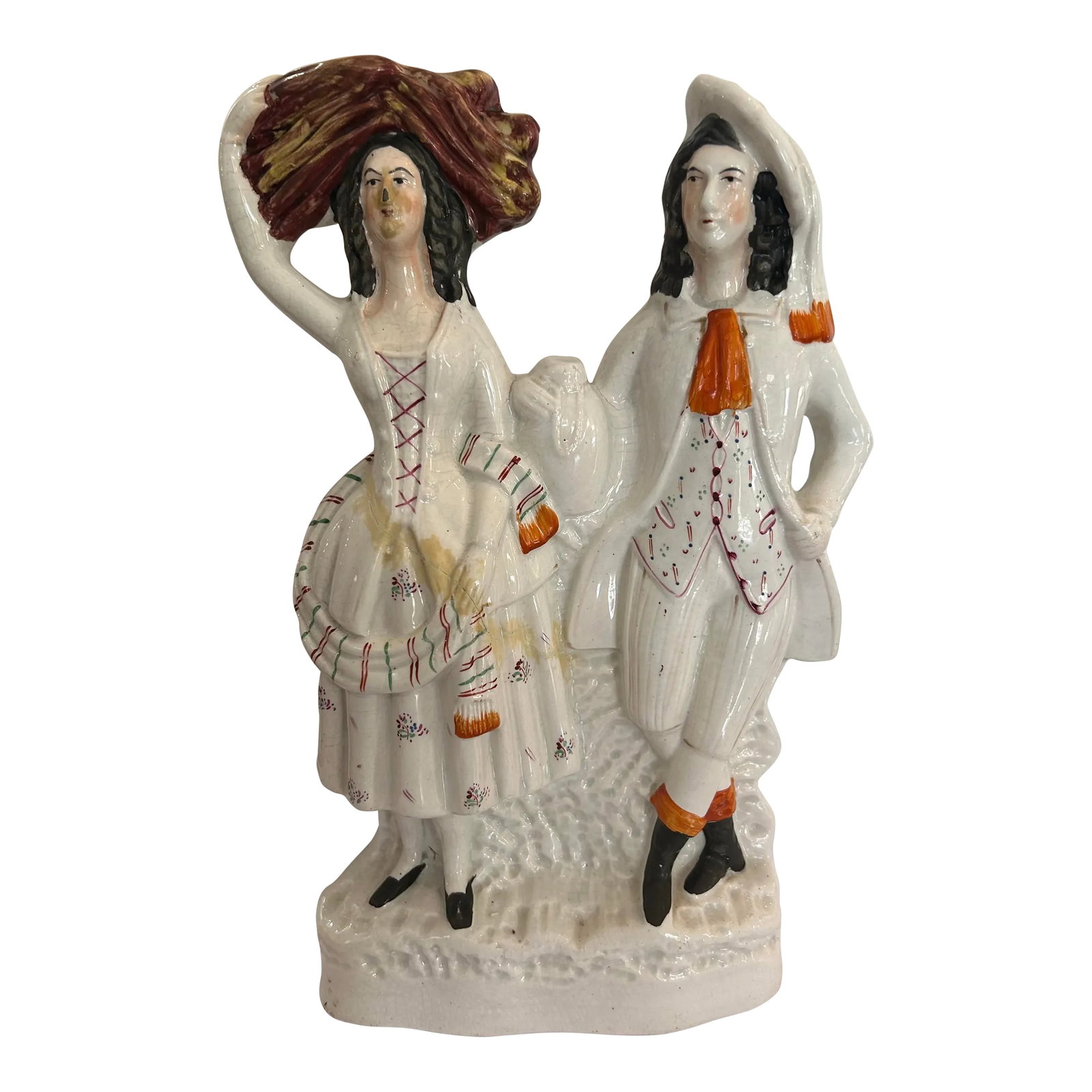 Large Antique Staffordshire Figurine Depicting a Highland Harvest Couple: Large Antique Staffordshire Figurine depicting Highland Harvest Couple Circa 1850 Fair condition. There was a crack that was repaired and the glue has yellowed over time. It can be removed with a