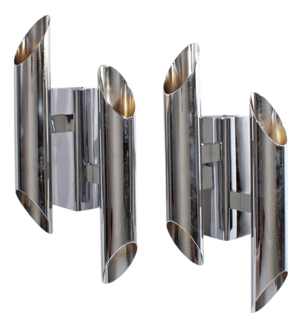Gianni Celada Fontana Arte Chrome Sconces: A pair of wall sconces designed by Italian designer Gianni Celada. Produced by Fontana Arte, these chrome sconces are both made from two tubes with openings that are connected to a triangular wall mou