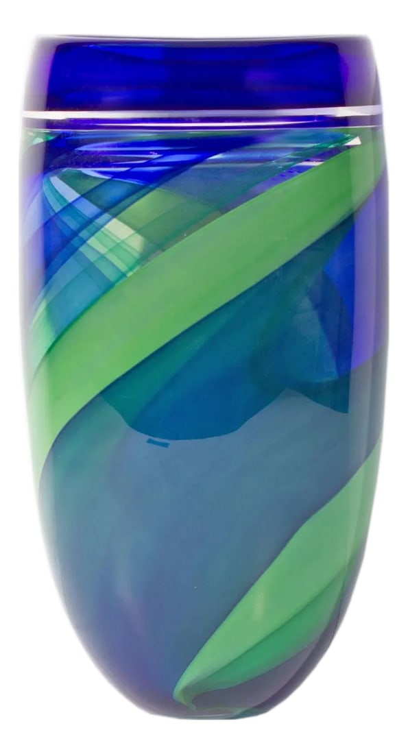Anna Ehrner Kosta Boda Limited Edition Vase: A limited edition glass vase designed by the Swedish glass artist Anna Ehrner (born 1948) for Kosta Boda. This substantial vase features a dark blue rim and a diagonally striped green and blue body. T