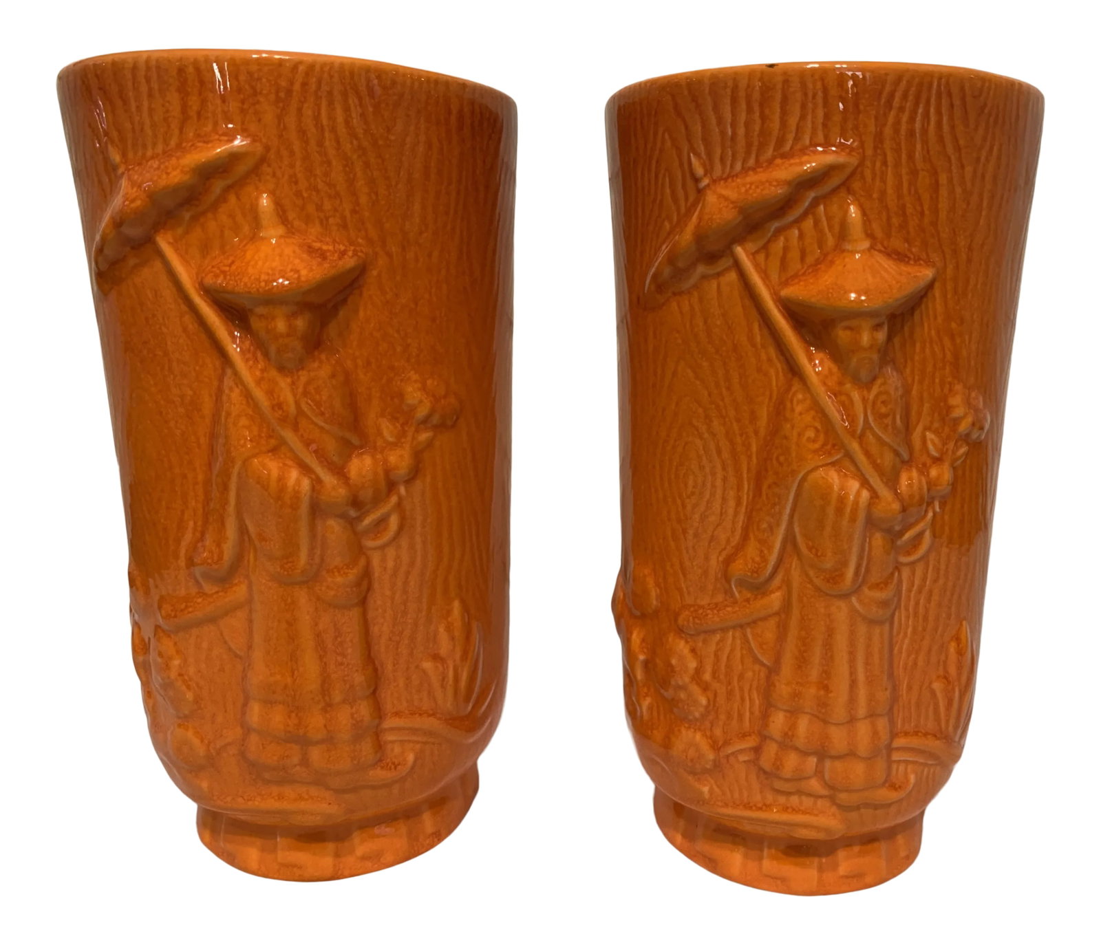 Vintage Orange Glazed Chinese Vases - A Pair: Wonderful and rare pair of Chinese vases with a beautifully raised, molded design on two sides. On one side is the figure of a Chinaman in traditional robe and conical hat and carrying a parasol. On t