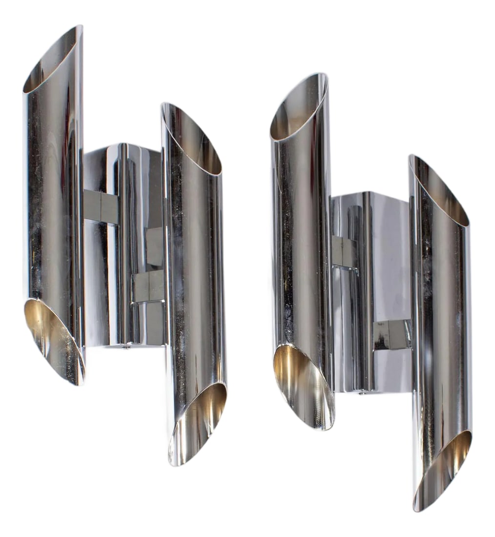 Gianni Celada Fontana Arte Chrome Sconces: A pair of wall sconces designed by Italian designer Gianni Celada. Produced by Fontana Arte, these chrome sconces are both made from two tubes with openings that are connected to a triangular wall mou
