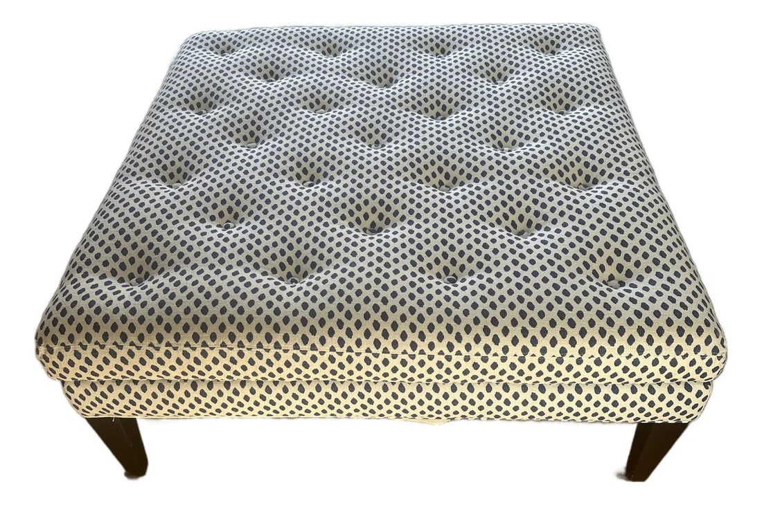 Oversized Cocktail Ottoman: Stylish and versatile upholstered ottoman featuring a soft, neutral fabric with a subtle blue geometric pattern. The cushioned, button-tufted top makes it comfortable as a footrest, extra seating, or