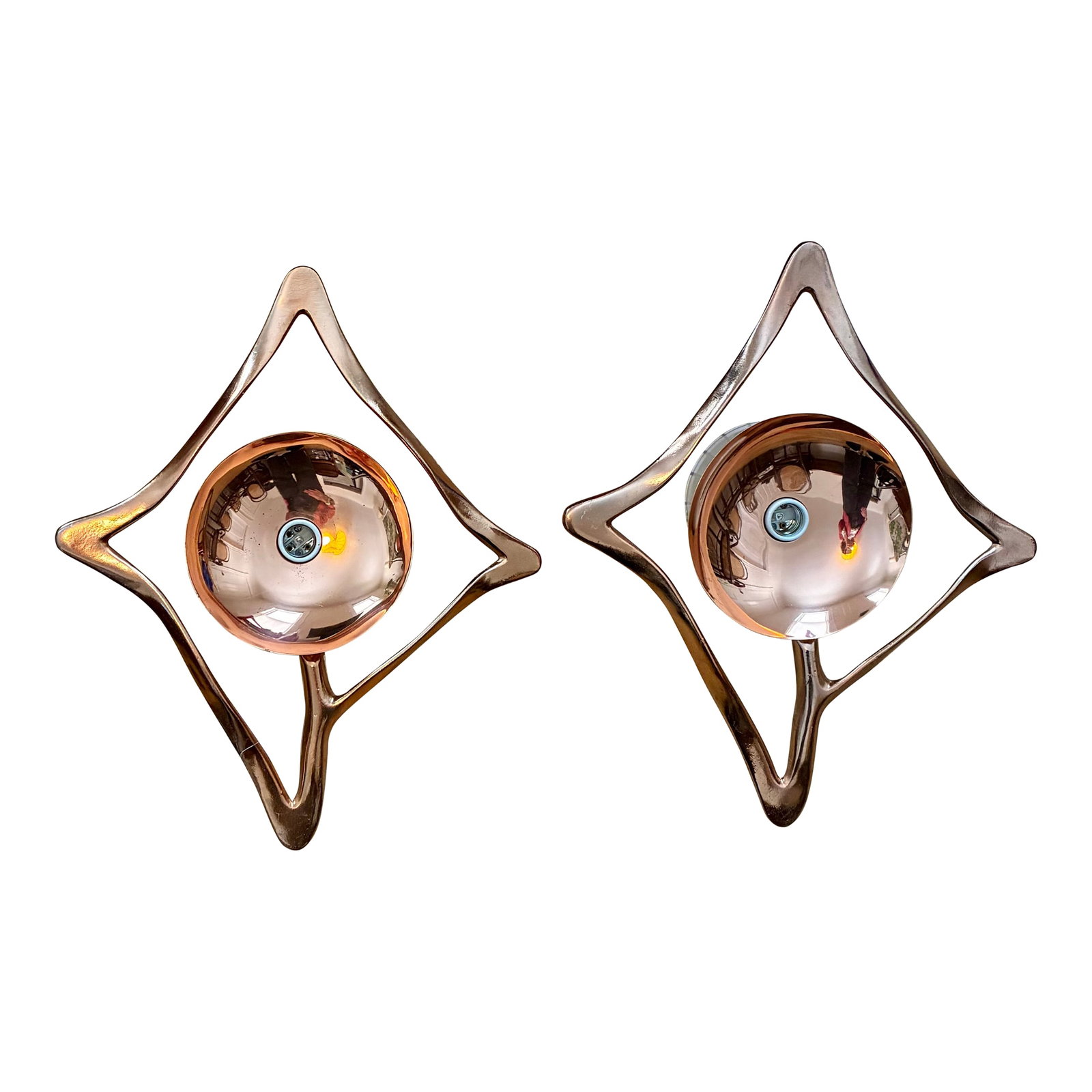 Mid 20th Century Copper Global Views Abstract Sconces: Pair of abstract, geometric frames surrounding a polished copper bowl-shaped reflector. Brutalist or Mid-Century Modern aesthetic, designed to reflect light and create a striking visual effect.